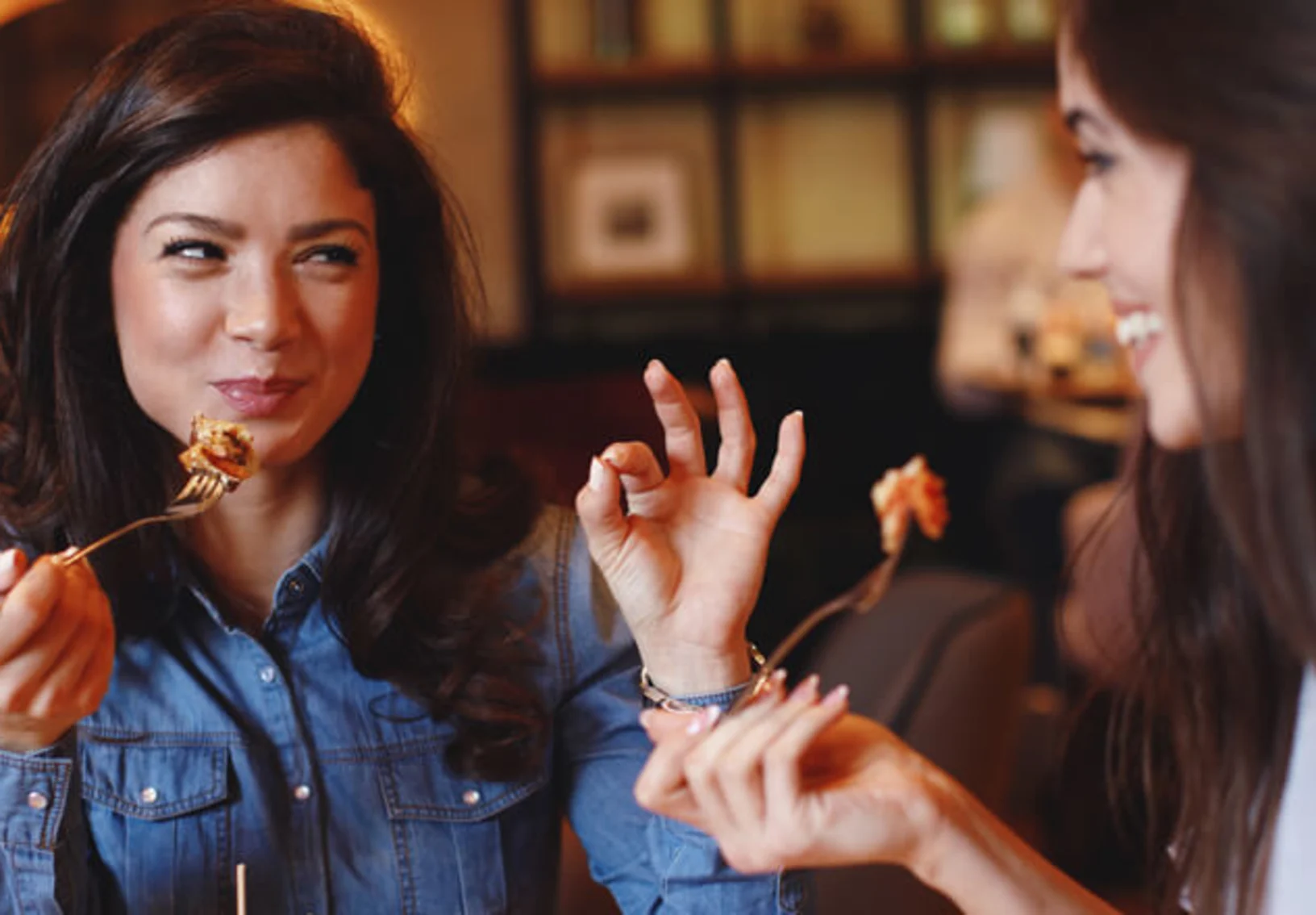 two women eating food